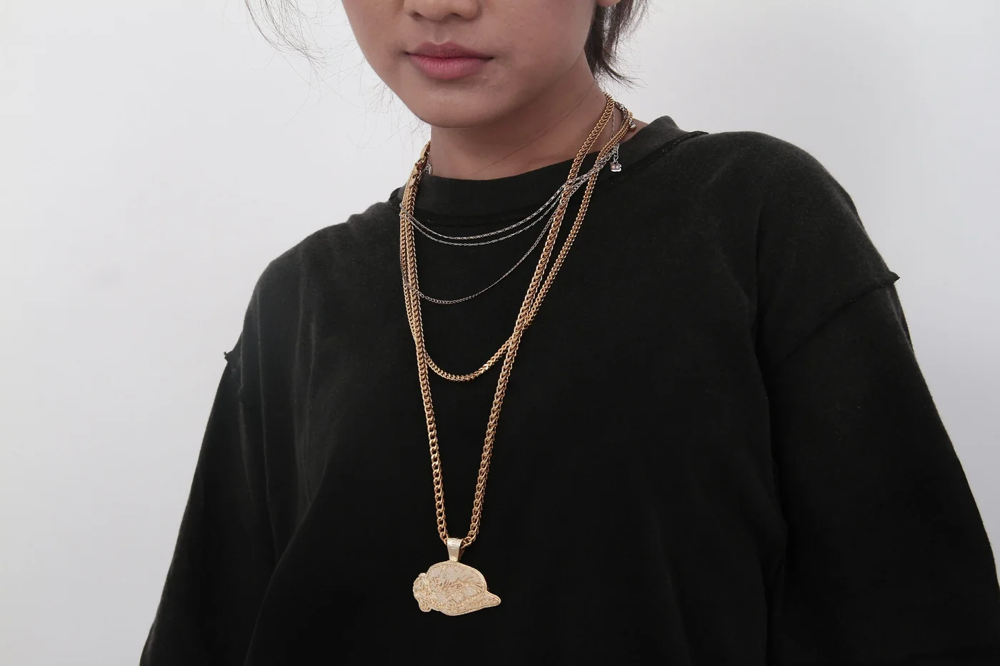 Illustrative editorial image of layered necklaces; not Langrum Ventures inventory photography.