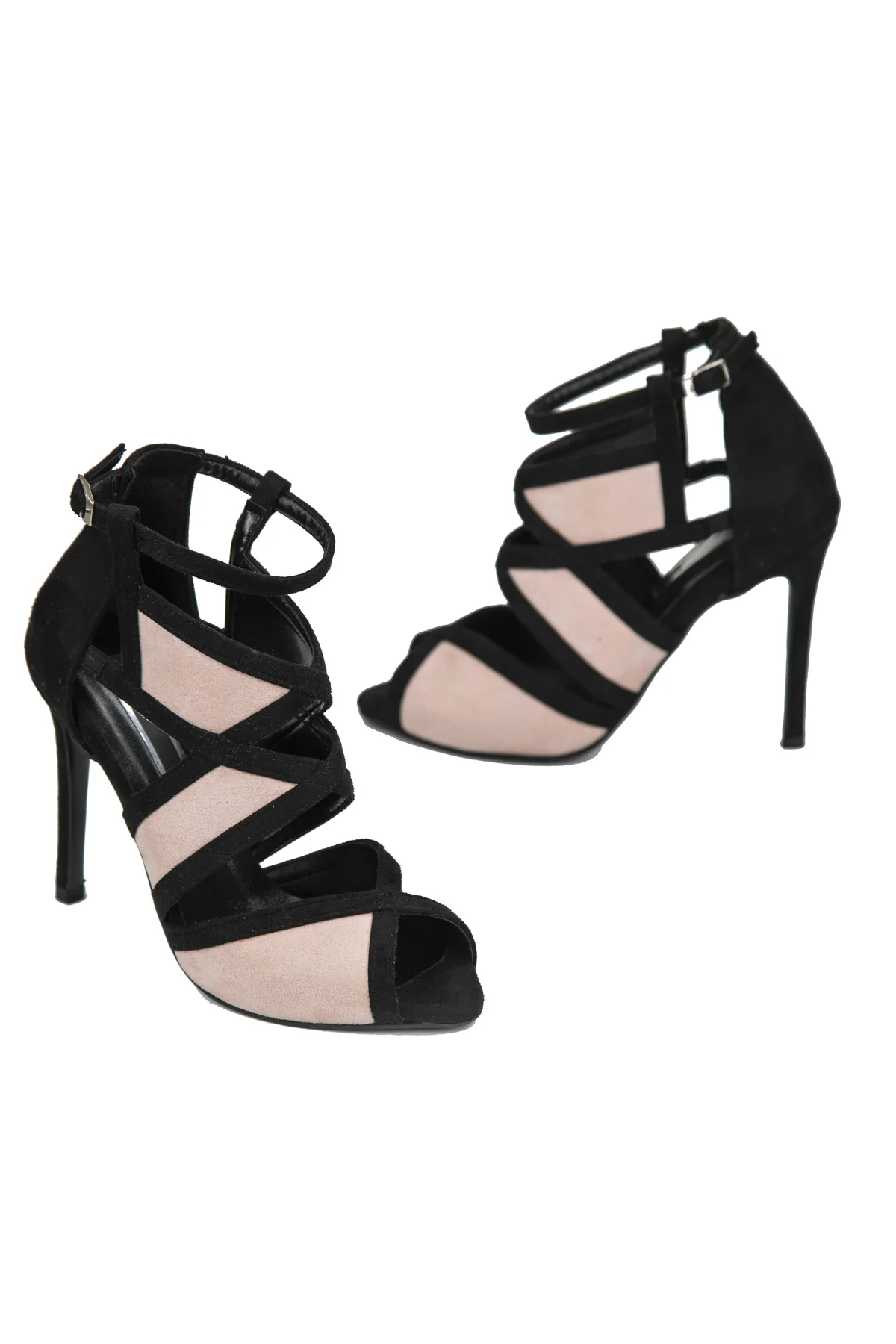 Illustrative editorial image of strappy heels; not Langrum Ventures inventory photography.